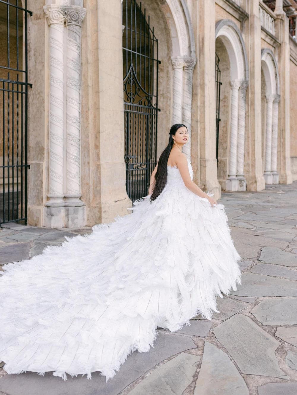 Wedding dresses with 2025 feathers at the bottom