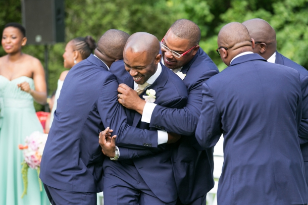 Groom and Groomsmen in Classic Navy and White Tuxedos