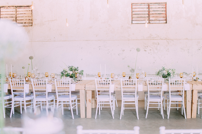 White Tiffany Chairs and Wooden Tables