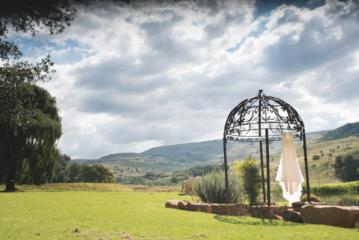 Wedding Dress Hanging from Gazebo | Credit: Those Photos