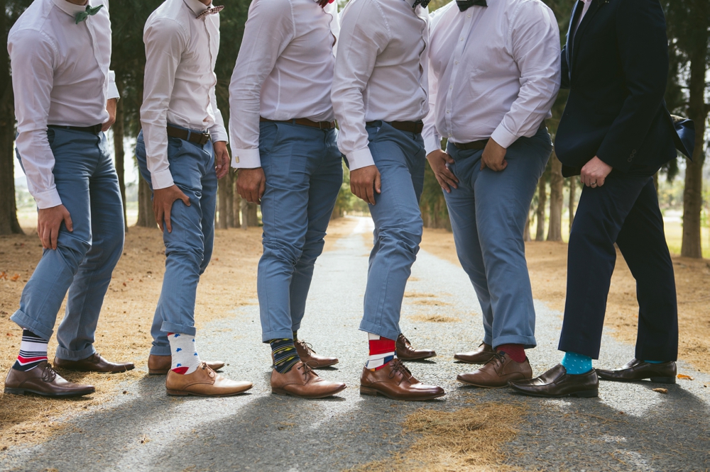 Groomsmen in Pastel Trousers & Mismatched Socks