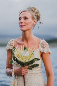 Boho Bride with White King Protea Bouquet | Credit: Bold As Love