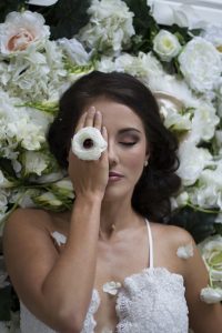Bride with Anemone & Floral Backdrop | Credit: Mooi Photography