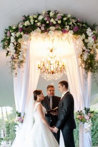 Luxe Draped Floral Arch with Chandelier | Credit: Tyme Photography & Wedding Concepts
