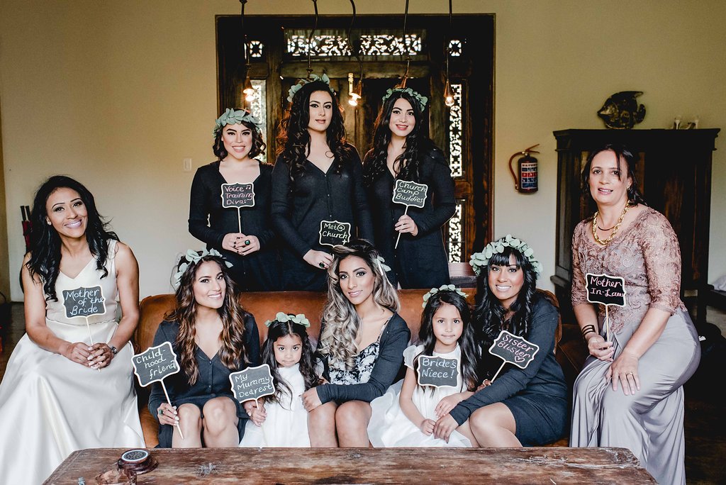 Bridesmaids with Signs | Image: Carla Adel