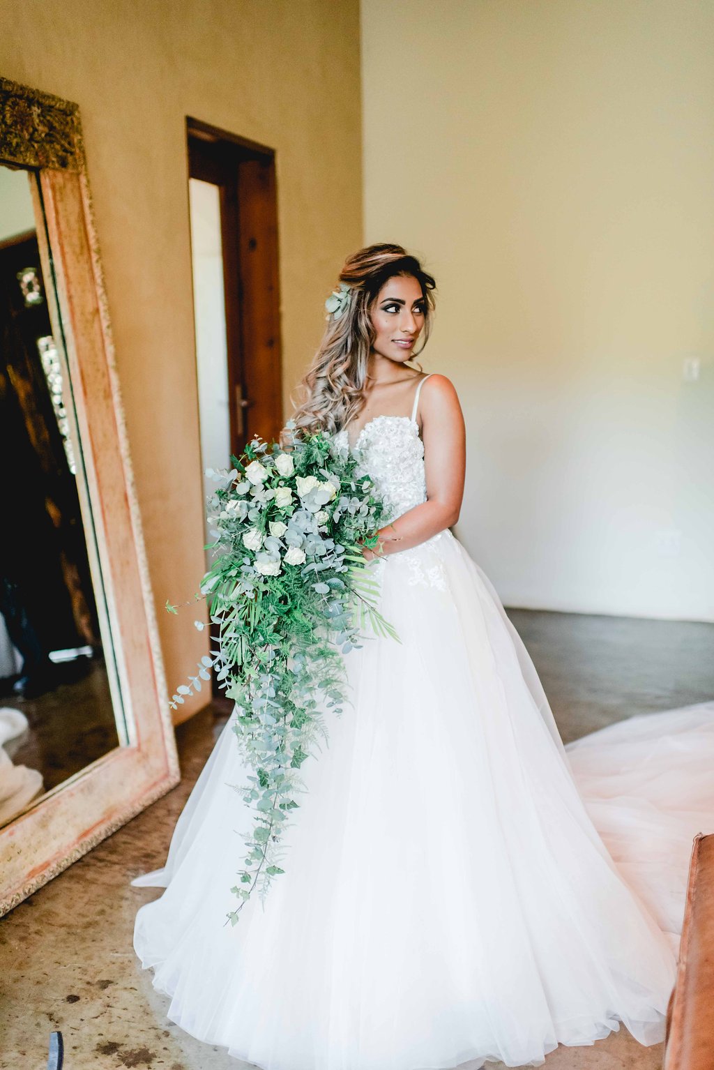 Bride with Cascade Greenery Bouquet | Image: Carla Adel