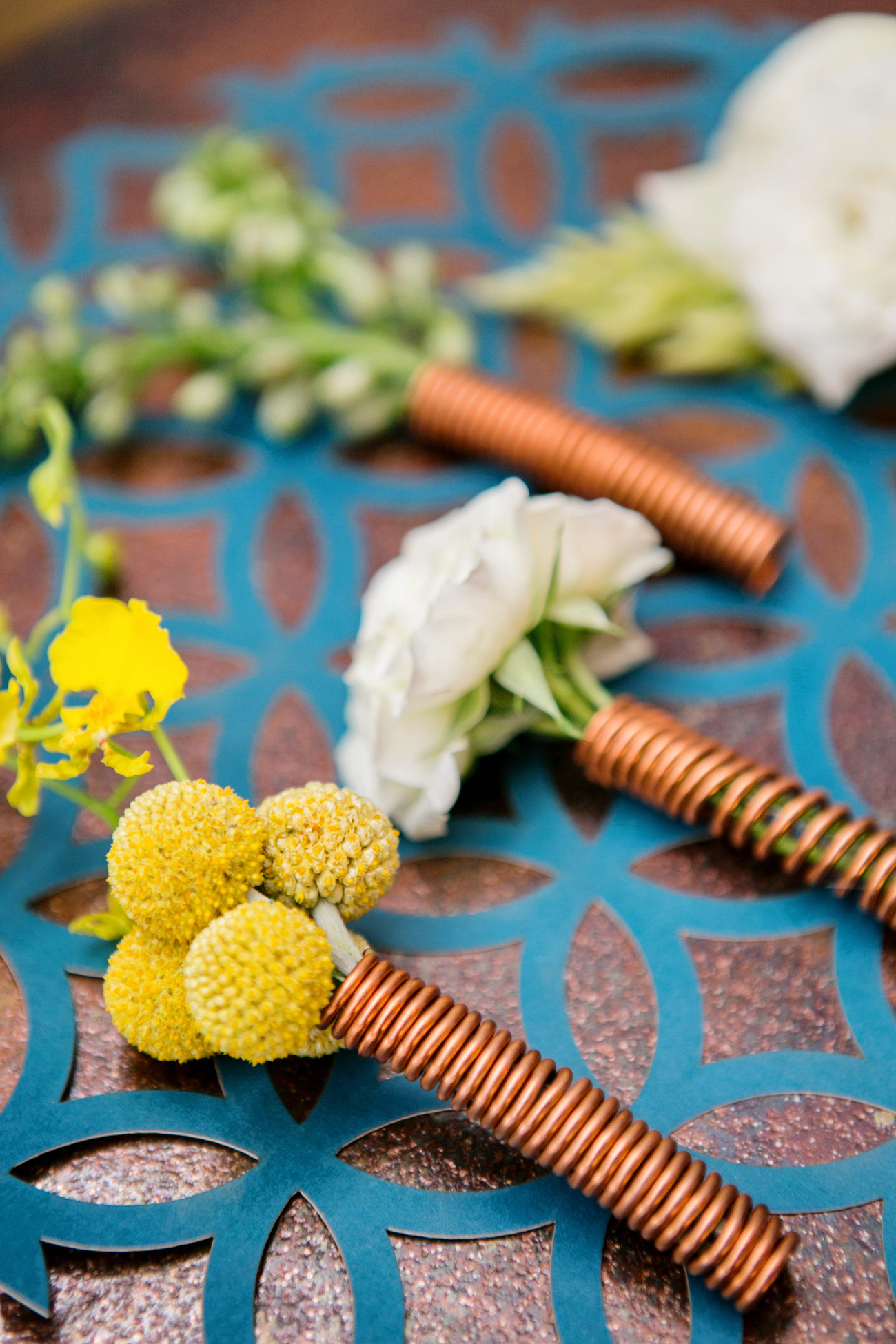 Copper Boutonnieres | Credit: Wedding Concepts & Tyme Photography