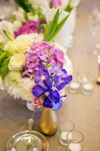 Purple Floral Centerpeice | Credit: Tyme Photography & Wedding Concepts