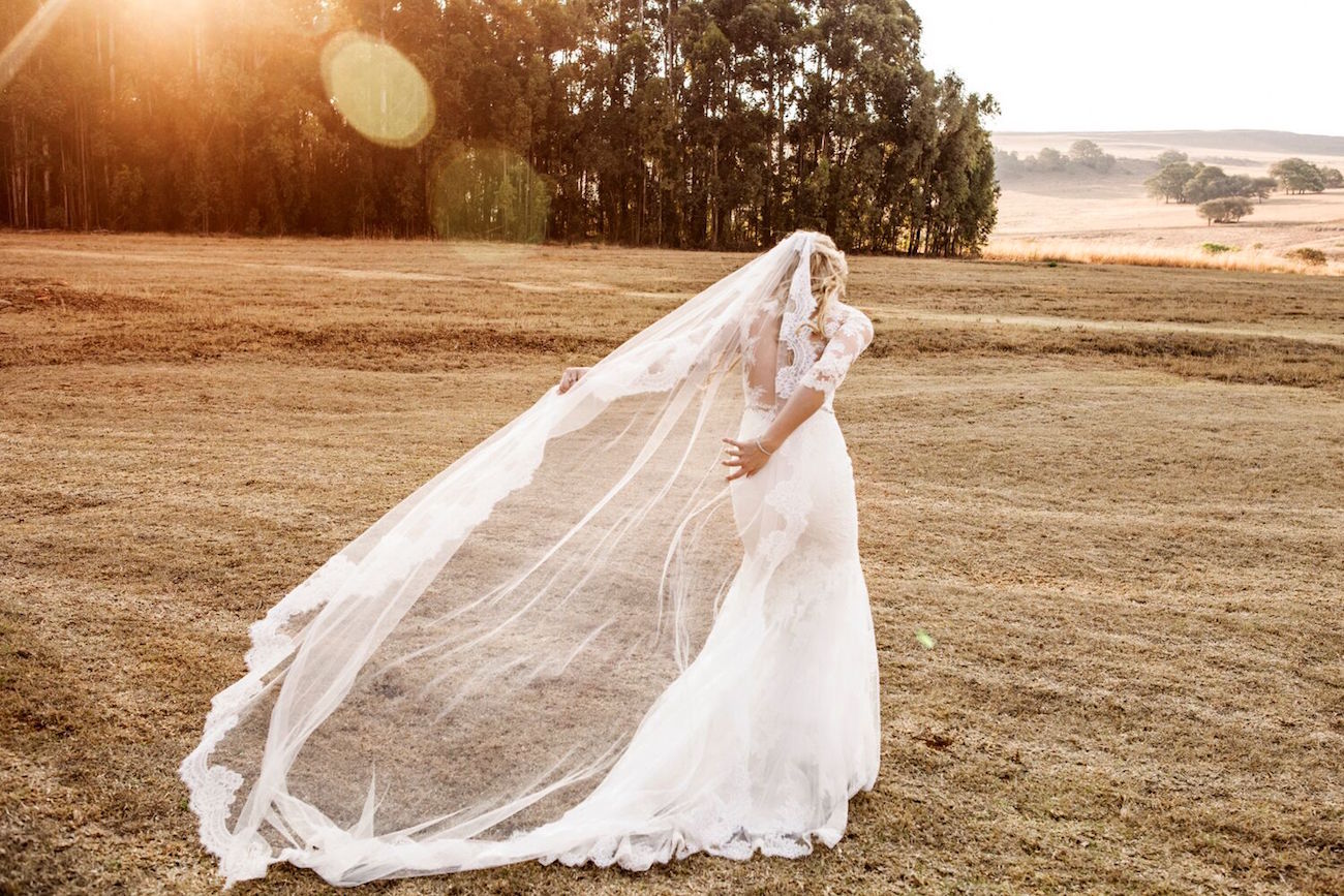 Lace Sleeve Illusion Wedding Dress & Cathedral Veil | Image: Daniel West