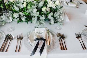 Place Setting with Black Ribbon Tie & Greenery | Image: Carla Adel