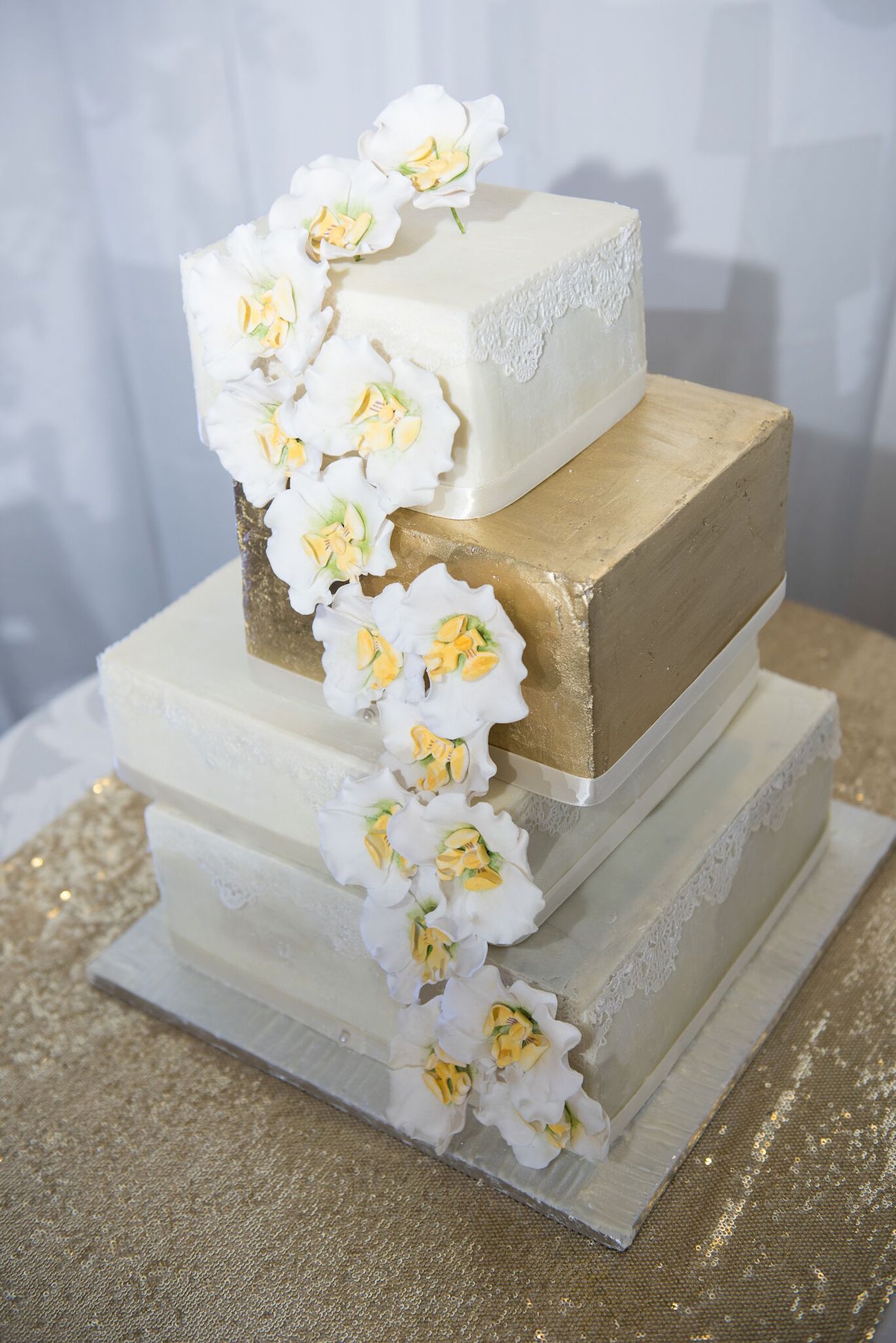 Gold and White Square Wedding Cake | Image: Daryl Glass