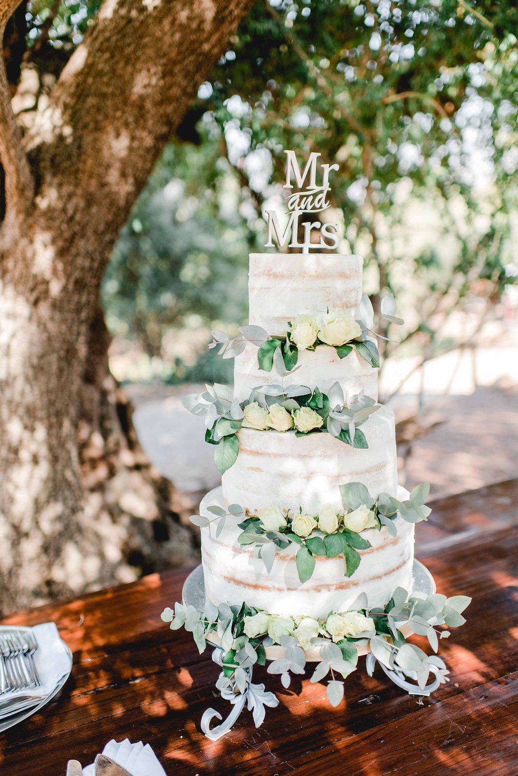 Semi Naked Wedding Cake with White Roses | Image: Carla Adel