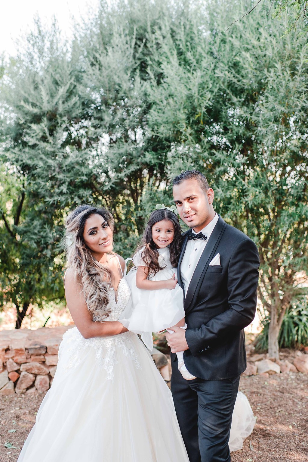 Bride & Groom with Daughter | Image: Carla Adel