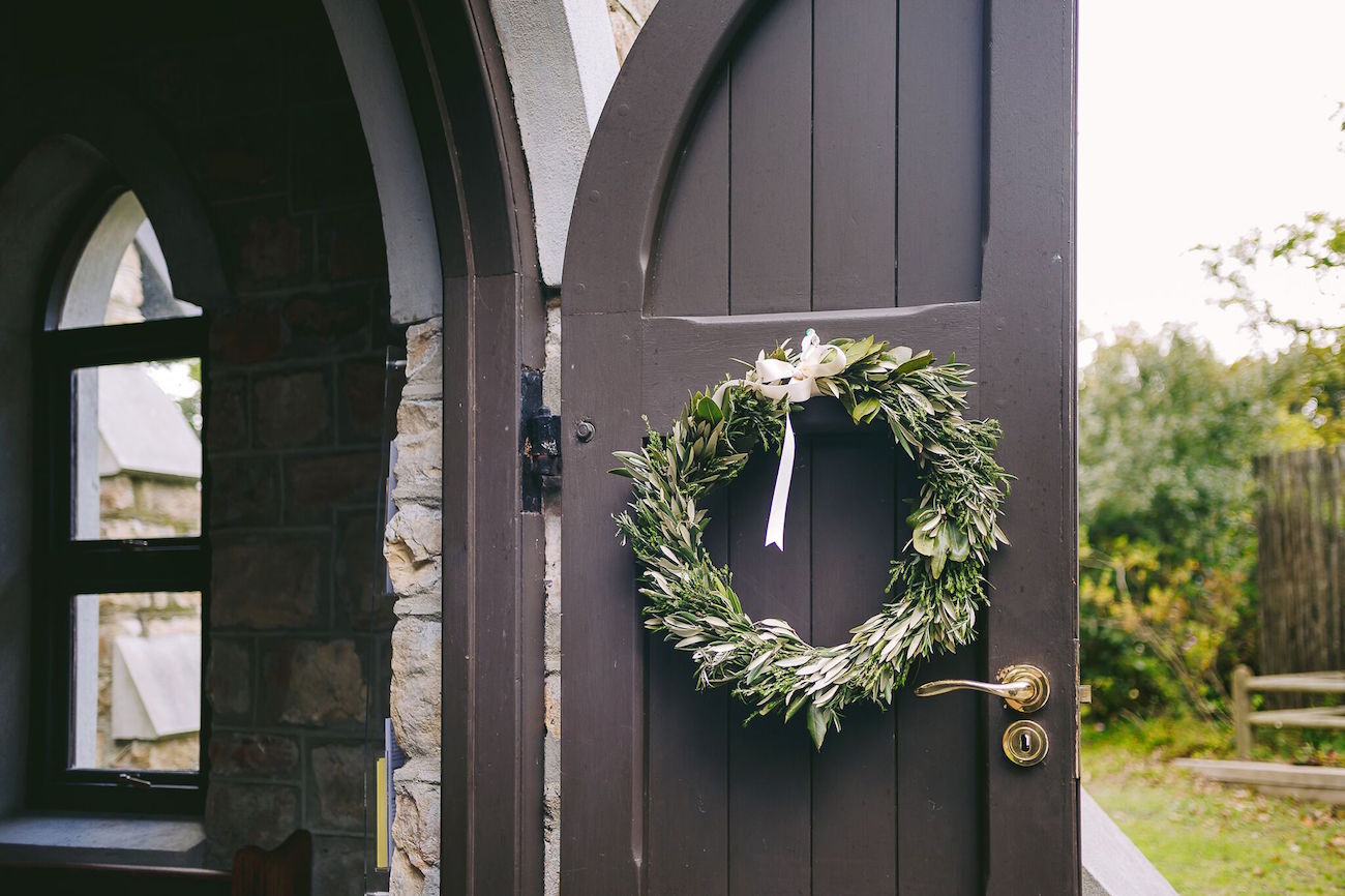 Greenery Wreath Ceremony Decor | Credit: Jani B & Bright and Beautiful