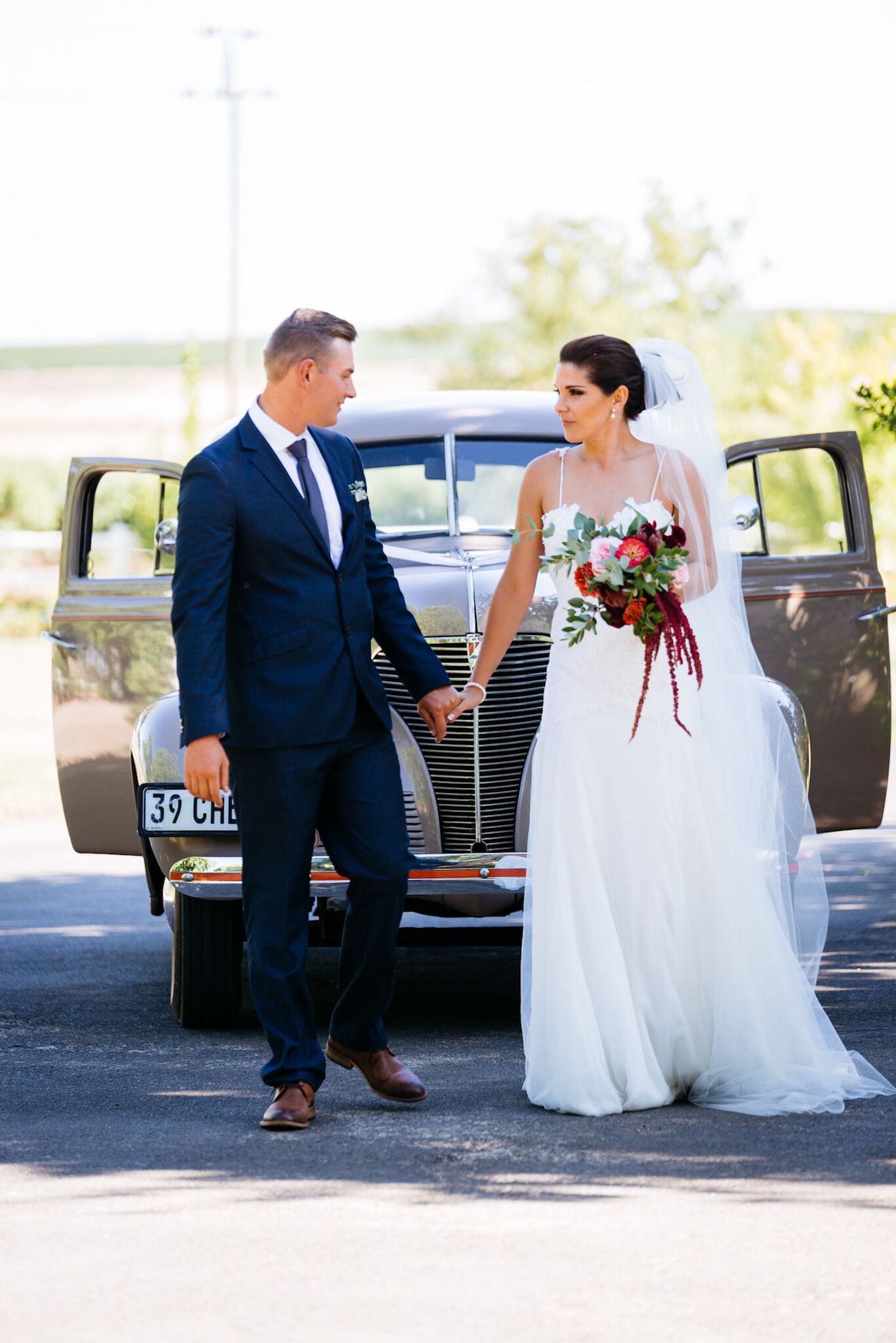 Bride & Groom with Vintage Car | Credit: Matthew Carr