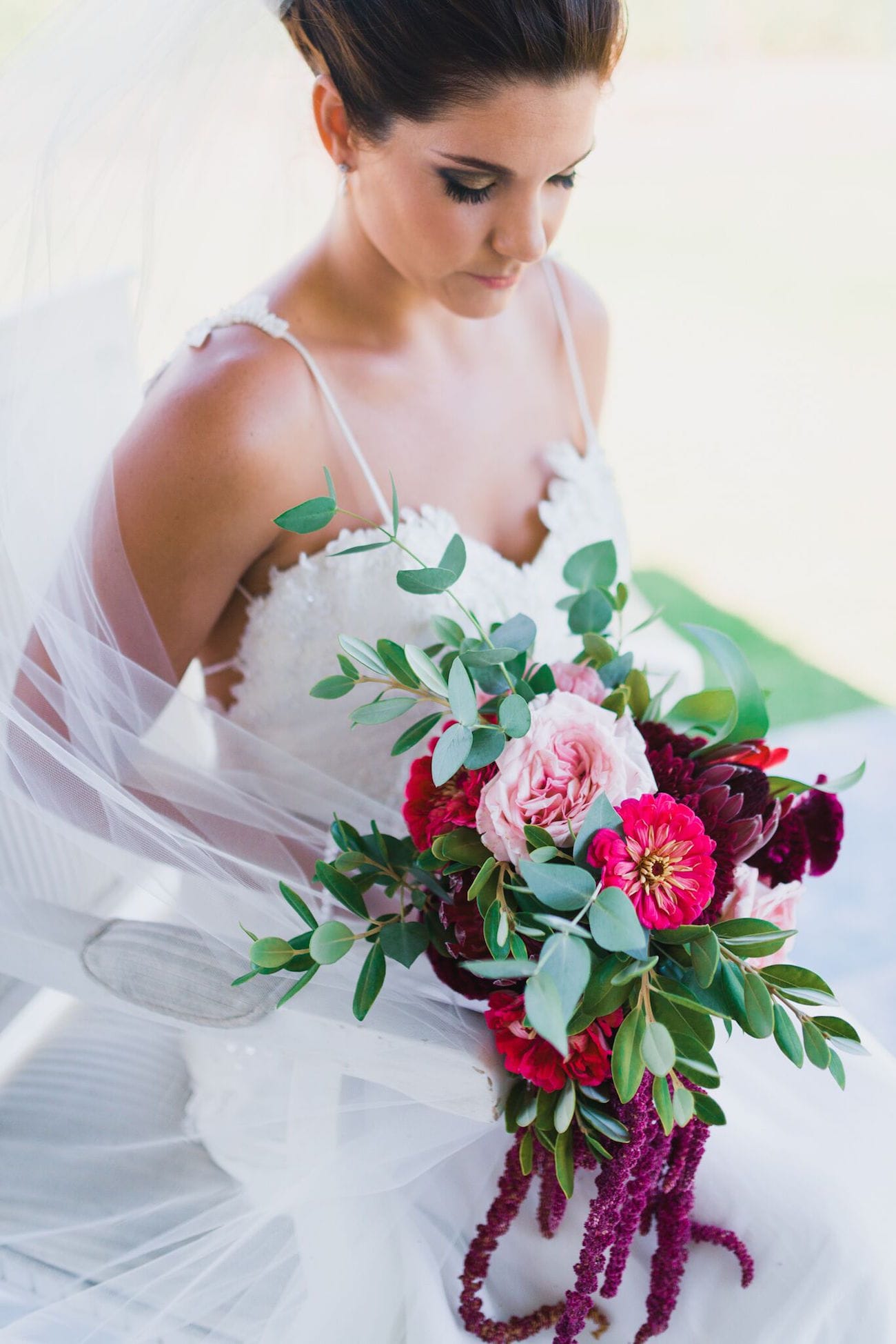 Jewel-tone bouquet with proteas, peonies and amaranthus | Credit: Matthew Carr