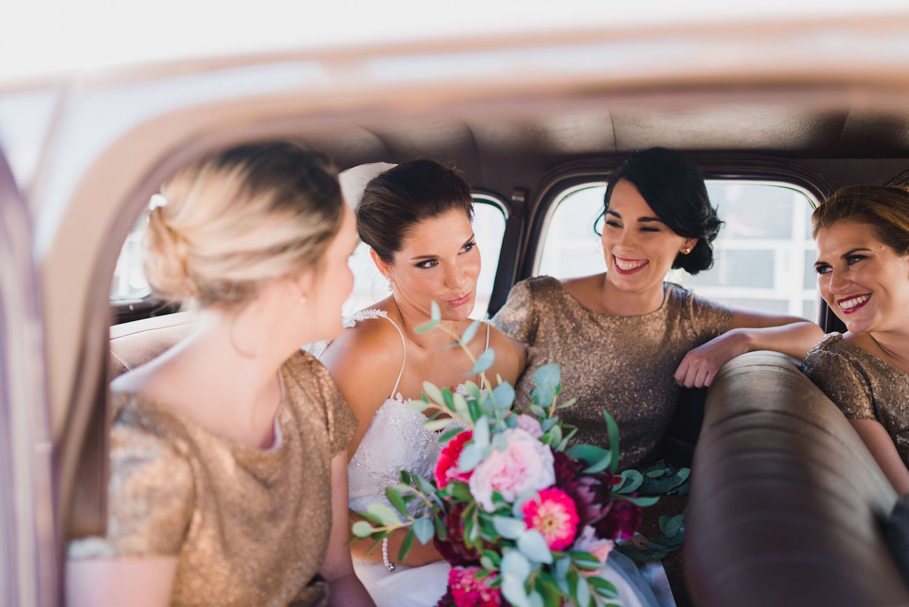 Bride and bridesmaids in vintage car | Credit: Matthew Carr