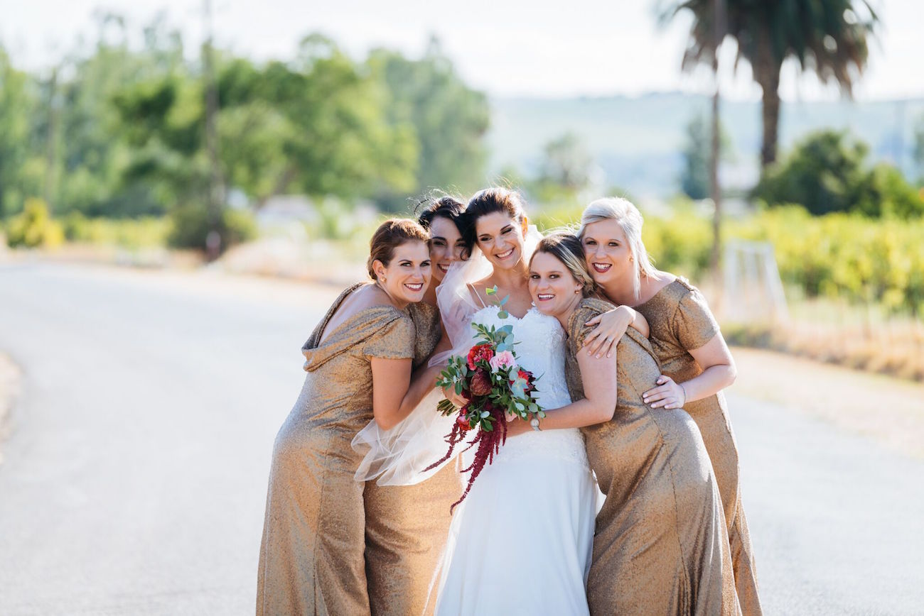 Long gold cowl back bridesmaid dresses | Credit: Matthew Carr