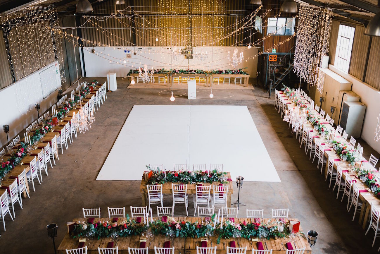 Barn wedding decor with central dance floor | Credit: Matthew Carr