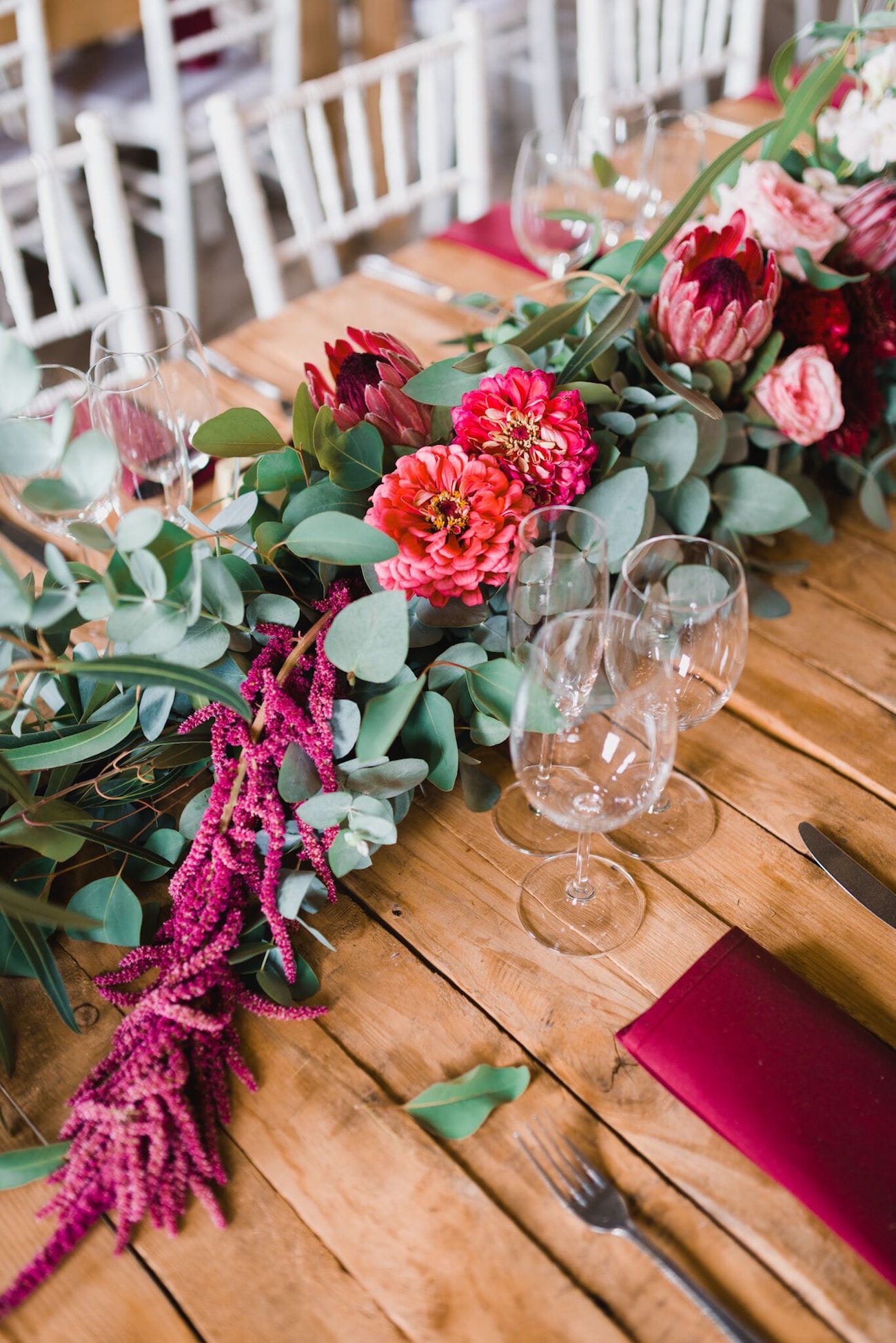 Greenery, protea and amaranthus floral runner | Credit: Matthew Carr