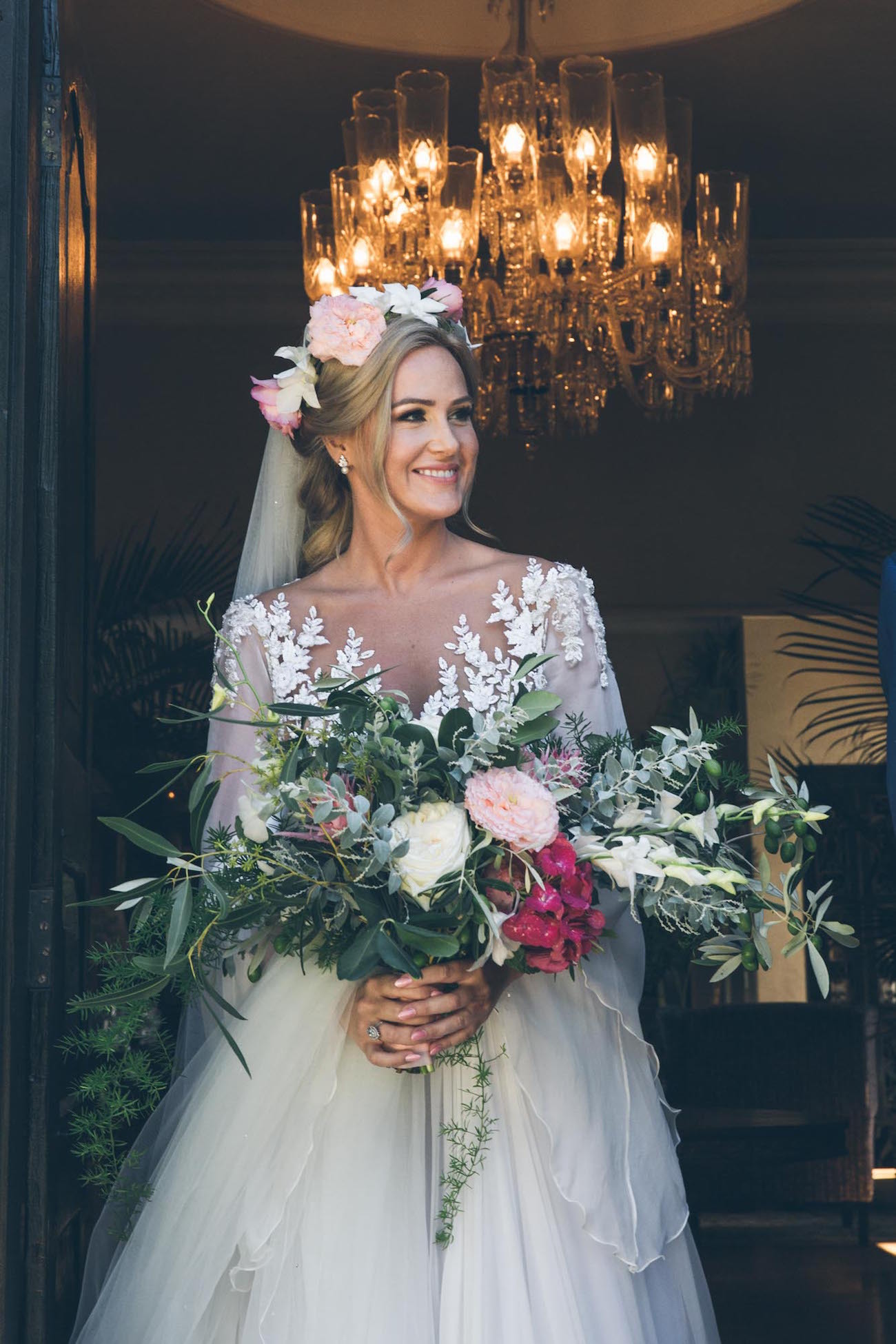 Bride with handtied bouquet and floral crown | Credit: Shanna Jones
