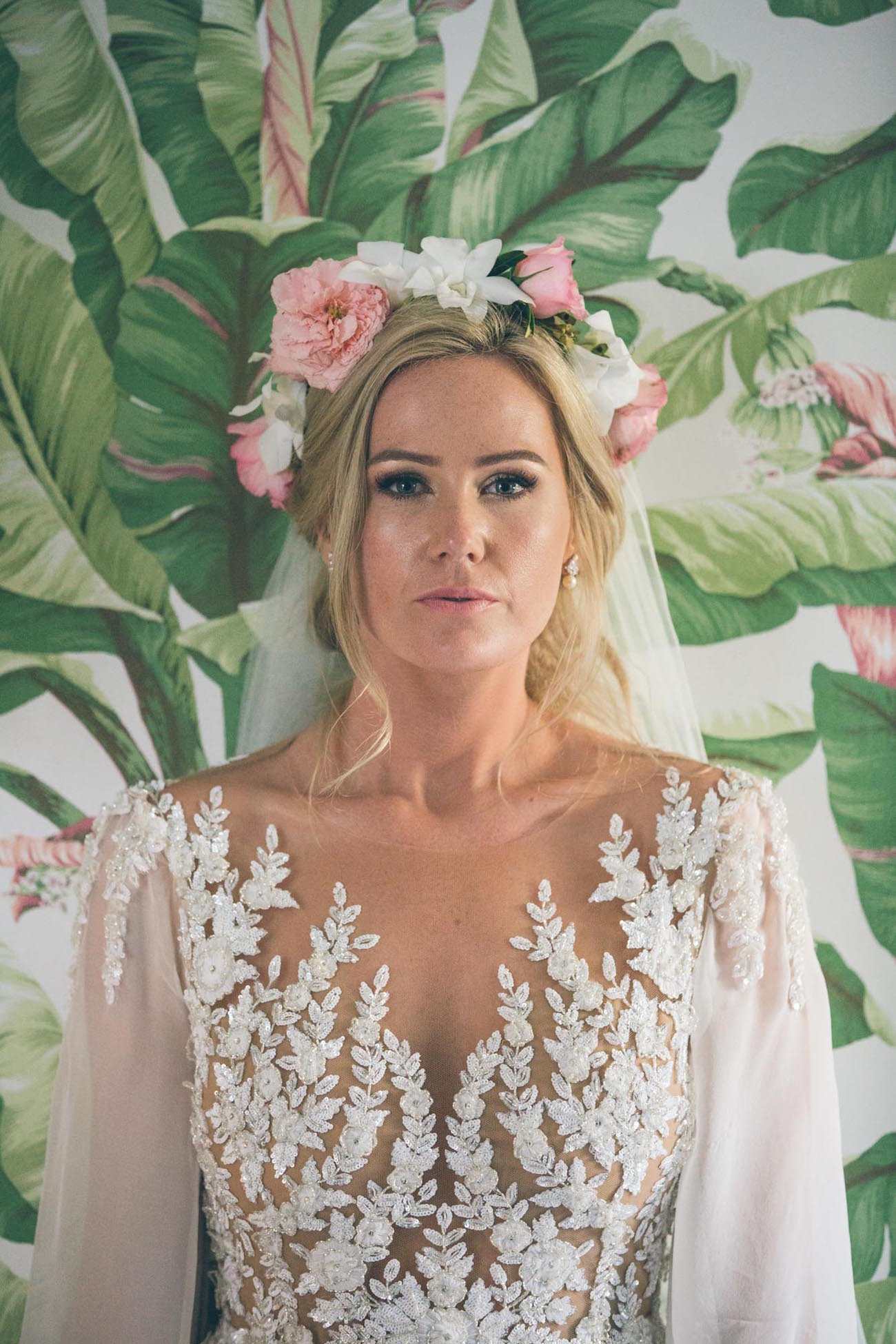 Bride in pink floral crown | Credit: Shanna Jones