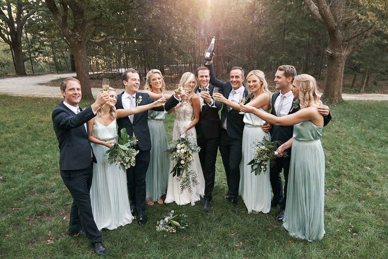 Wedding Party Celebrating with Champagne | Image: Knit Together Photography