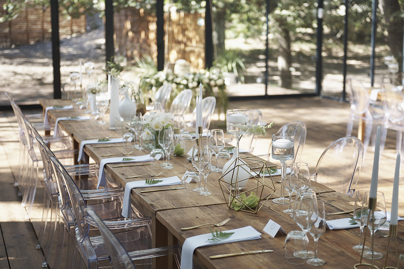 Raw Wood Table Wedding Decor with Ghost Chairs | Image: Knit Together Photography