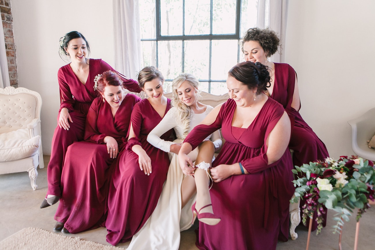 Maroon Bridesmaid Dresses | Joyous Jewel Tone Winter Wedding | Credit: Dust and Dreams Photography