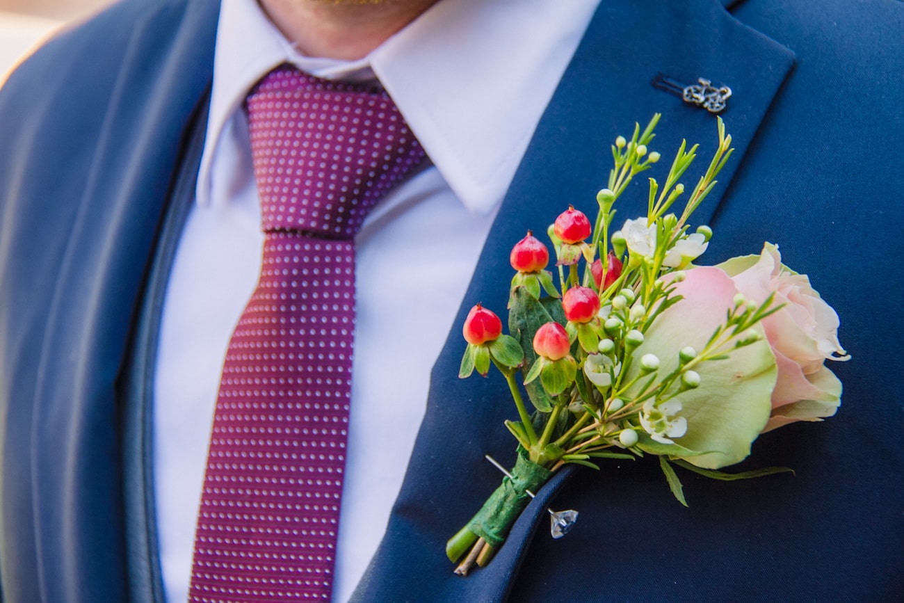 Berry Boutonniere | Joyous Jewel Tone Winter Wedding | Credit: Dust and Dreams Photography