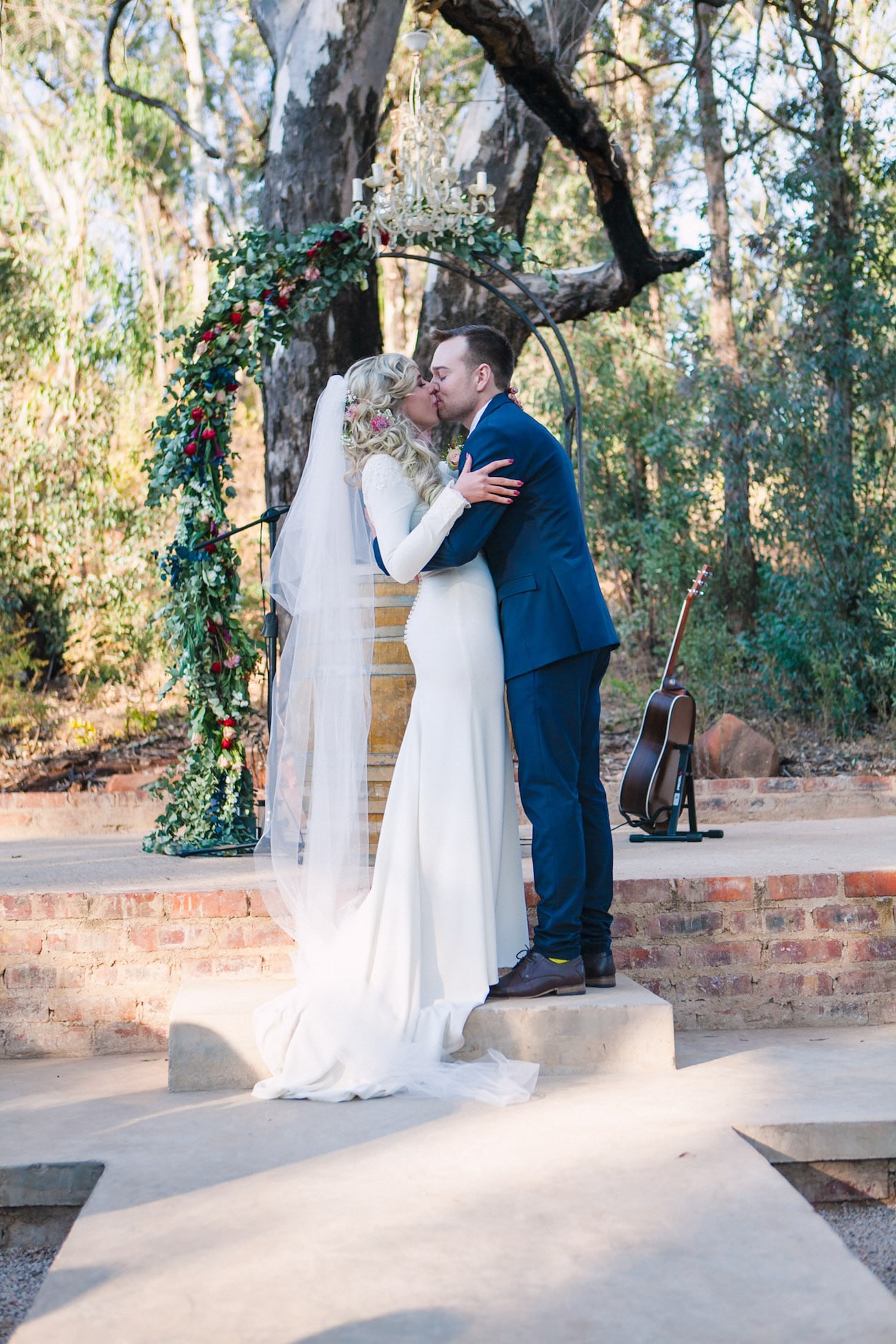 Forest Ceremony with Floral Arch | Joyous Jewel Tone Winter Wedding | Credit: Dust and Dreams Photography