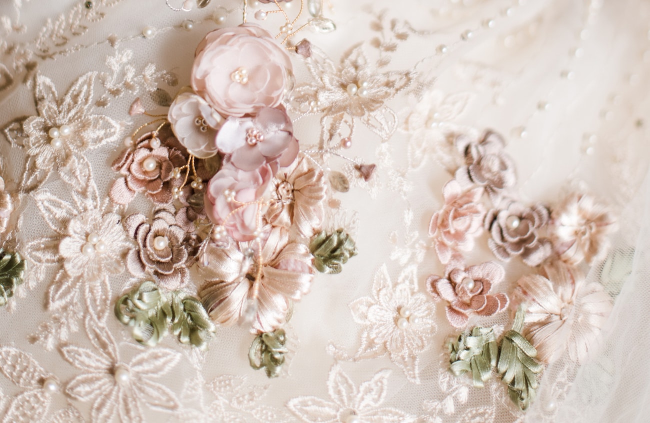 Ribbon Flower and Pearl Embellished Wedding Dress | Image: Roxanne Davison