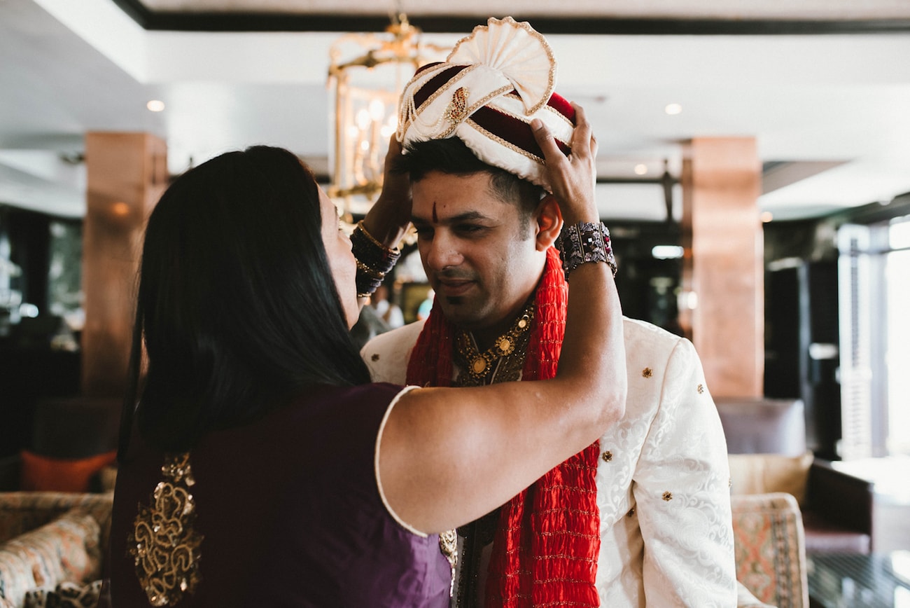 Groom's Mother Putting On Safa | Image: Claire Thomson