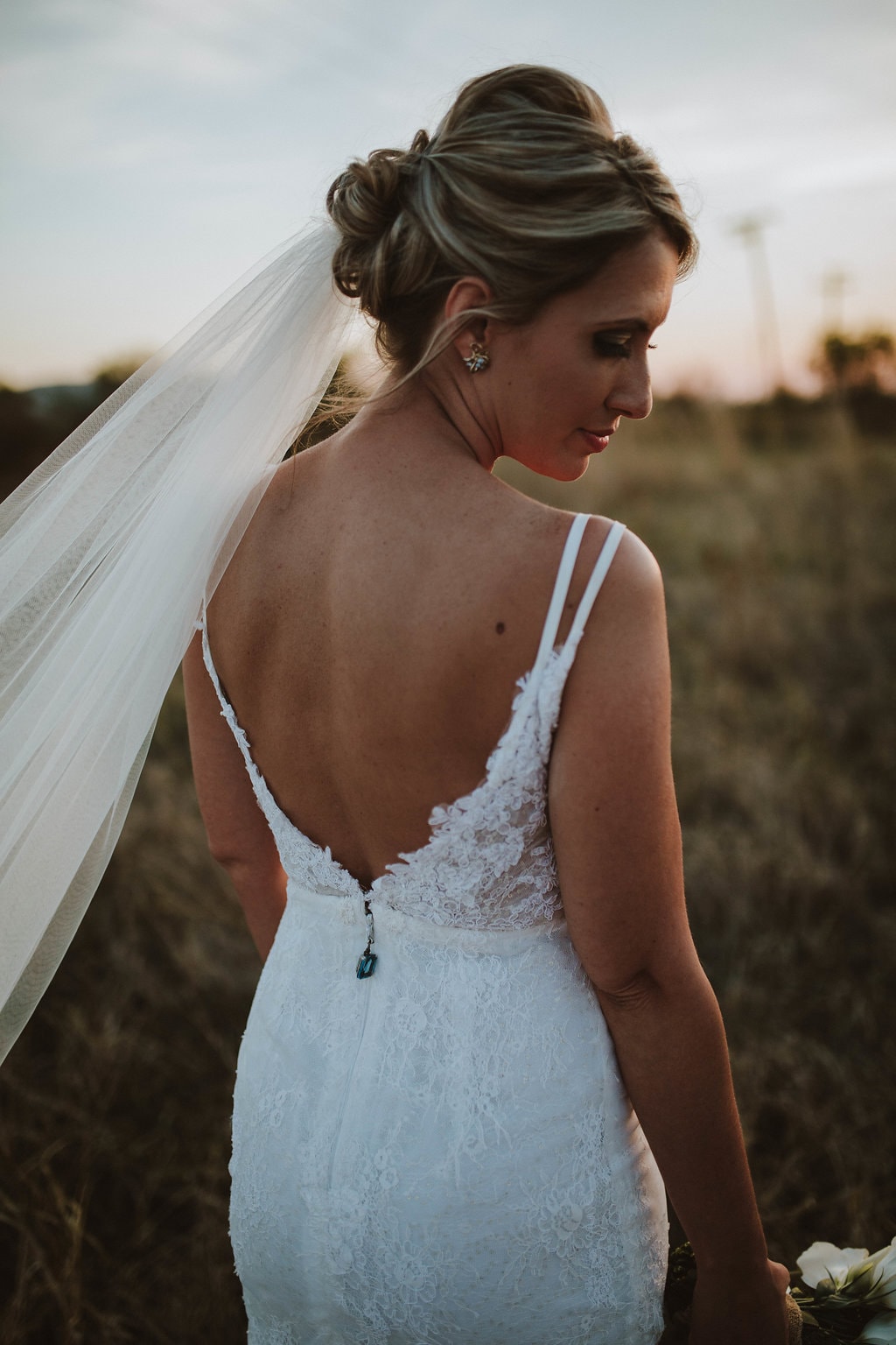 Kobus Dippenaar Low Back Wedding Dress with Heirloom Jewel | Image: Jessica J Photography