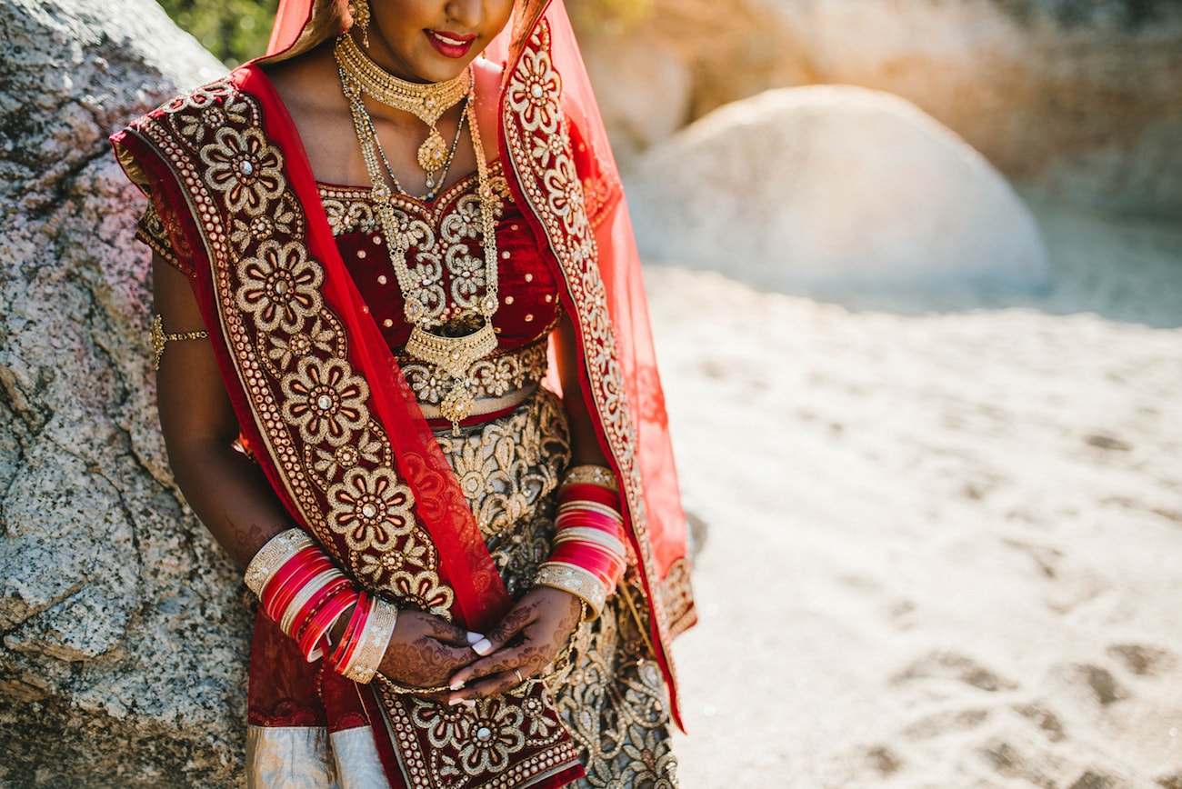 Scarlet Velvet & Gold Embroidery Bridal Lehnga | Image: Claire Thomson