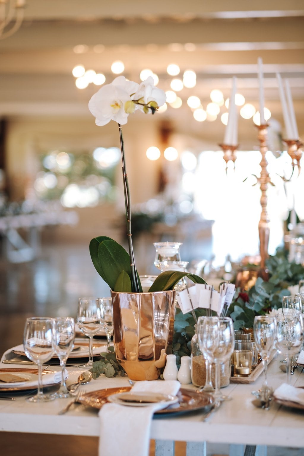 Orchid Centerpiece in Copper Vase | Image: The Shank Tank