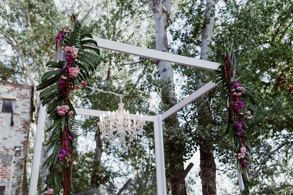 Modern Wedding Arch with Chandelier | Image: Jenni Elizabeth