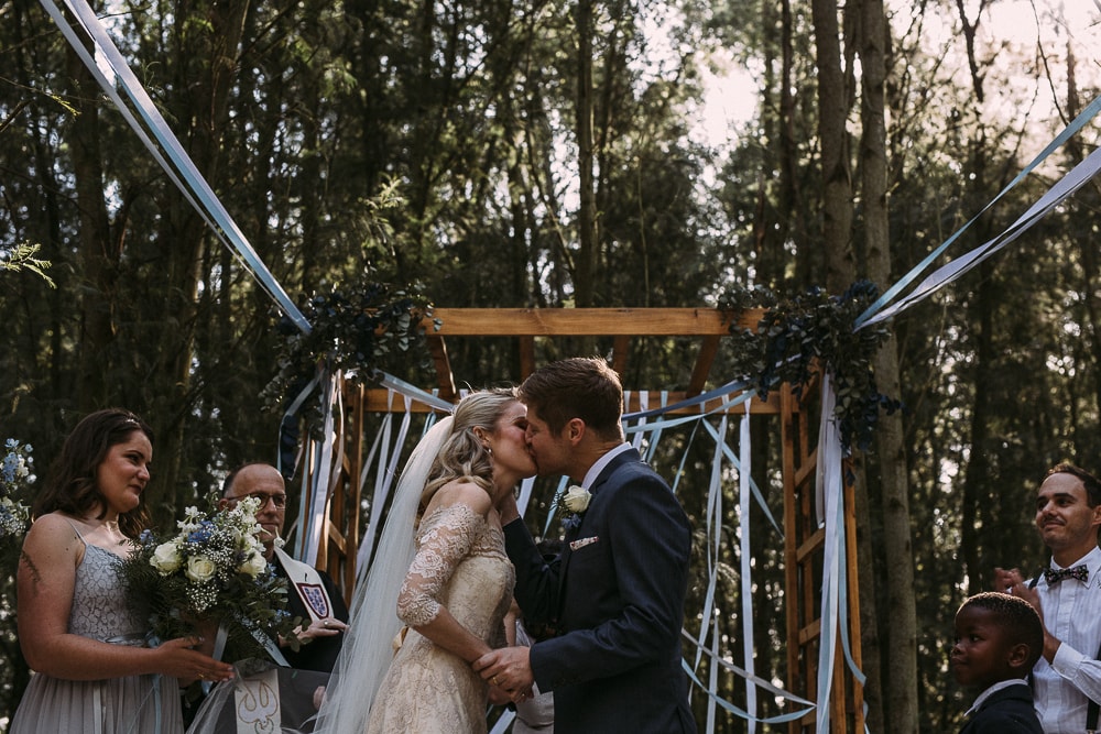 Forest Wedding Ceremony with Ribbon Arch | Image: Hayley Takes Photos